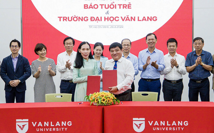 Trường đại học Luật TP.HCM và báo Tuổi Trẻ ký kết hợp tác - Ảnh 6.